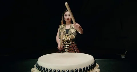 Epic performance beautiful Asian girl drummer Taiko makes a rhythm on the big Stock Footage