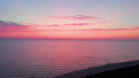 Epic pink and blue sunset over the calm Baltic Sea in Lithuania Stock Footage 321756006