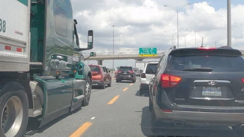 Epic POV driving plate slow moving rush hour traffic gridlock on highway Stock Footage 156060657