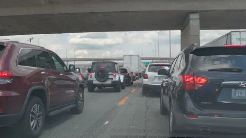 Epic POV driving plate slow moving rush hour traffic gridlock on highway 库存影片 156060892