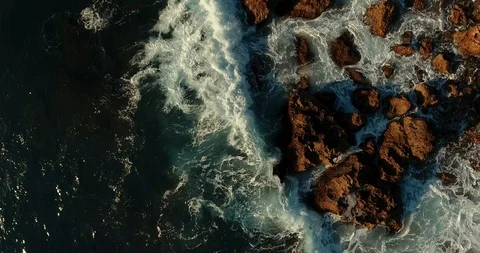 Epic, powerful, beautiful, aggressive frame. Huge waves crash against the rocks. Stock Footage 97300669