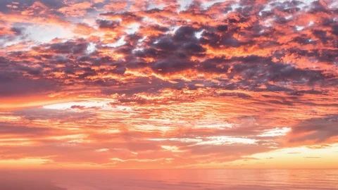 Epic red sky clouds over ocean beach in summer sunrise nature Time lapse Stock Footage 121955426
