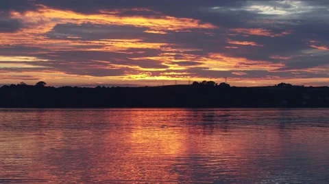 Epic red sunset over water Stock-Footage 66776884