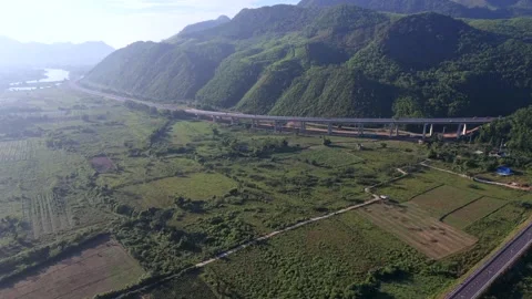 Epic River Valley Reveal with Mountain Highway in Vietnam Stock Footage 336857026