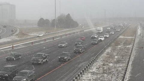Epic rush hour traffic jam on highway as snow starts to fall Stockbeeldmateriaal 149546394