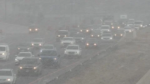 Epic rush hour traffic jam on highway as snow starts to fall Stockbeeldmateriaal 149546959