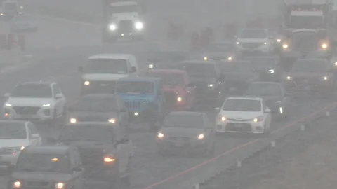 Epic rush hour traffic jam on highway as snow starts to fall Stockbeeldmateriaal 149606393