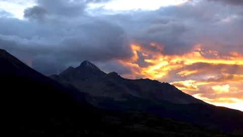 Epic SanJuan mountain sunset with fast moving clouds in Colorado Video stock 329660010