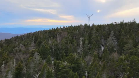 Epic shot of mountain top with wind turbine 動画素材 132249389