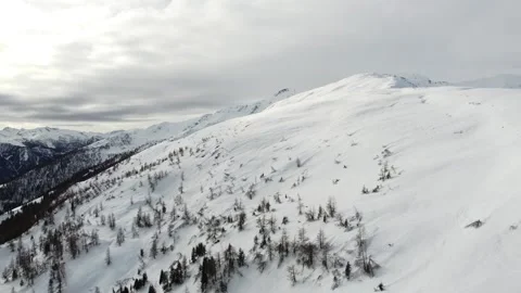Epic shot of snow covered mountain ridge on a winter day Stock Footage 145804238
