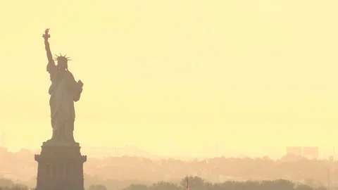 Epic Shot of the statue of liberty  and New York during sunset Video stock 81459645