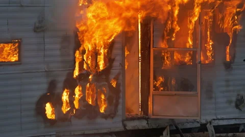 Epic shot of a trailer home on fire. House engulfed in flames with fire and Stock Footage 232336933