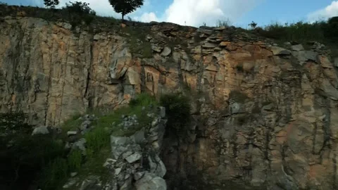 An epic side view of falling heavy rocks. Stock Footage 242379770