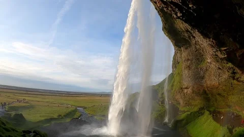 Epic side view of Seljalandsfoss waterfall and coastal plains, Iceland Stock-Footage 334793547