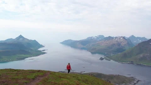Epic Slow Motion Adventure Travel Girl Walks Trail in Lofoten Stock Footage 258497145