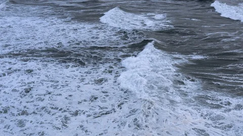 Epic slow-motion breaking wave rolls towards shore at dusk Stock Footage 112705196