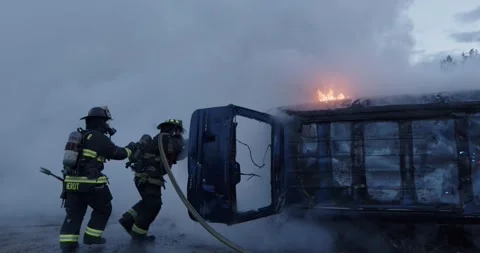 Epic Slow Motion Firefighters Extinguish Car Fire Auto Accident Stock Footage 244435435
