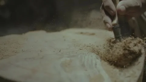 Epic Slow Motion Shot of Woodworker Brushing Sawdust with Flying Particles Vídeos de archivo 333677111
