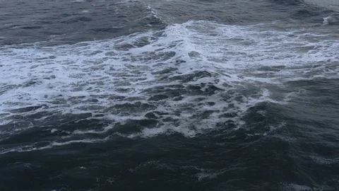 Epic slow-motion wave rolls towards shore at dusk Stock Footage 112704474