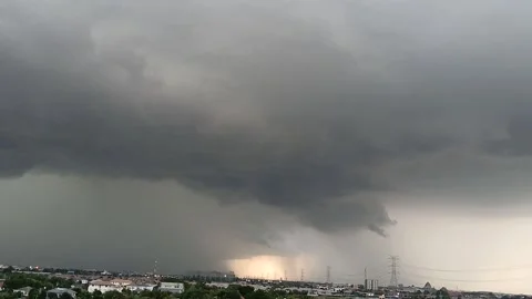 Epic storm clouds with bright magical highway spotlight over city footage Stock Footage 341465381
