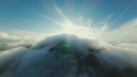Epic Sunburst FPV Drone Ascent Over Misty Mountain Peak Covered 스톡 동영상 319368161