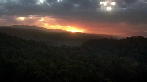 Epic Sunrise over wild forests and mountains with cloudy sky Stock Footage 251552756