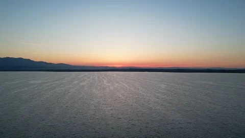 Epic Sunrise Pullback Above the Aegean Sea with Flying Bird, Porto Lagos Gre Stock Footage 340557429