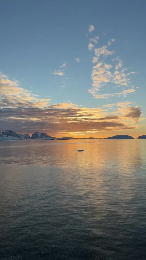 Epic Sunset Antarctica Cruise Ship Sailing Pan Right Across Glassy Water to.. Stock Footage 339283373