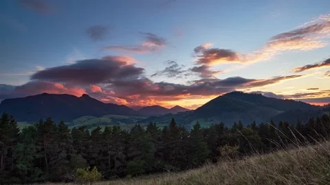 Epic sunset with colorful clouds in beautiful mountain countryside FHD footage Stock Footage 217369209