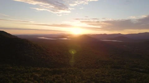 Epic Sunset Drone Towards Mountain Dramatic Landscape Clouds and Forest Stock Footage 256052495