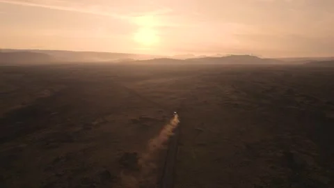 Epic Sunset Dust Trail Behind Vehicle Aerial Iceland Following 4 Wheel Drive Stock Footage 256713479