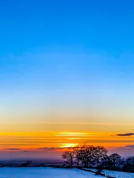 Epic sunset over a hill Stock Photos