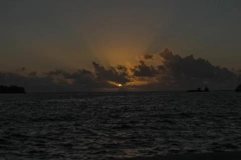 Epic Sunset rays of light shining up to the sky! Stock Photos
