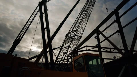 Epic Sunset Silhoette Of Crane On Construction Site 4K 48FPS SLO-MO Stock Footage 265701350