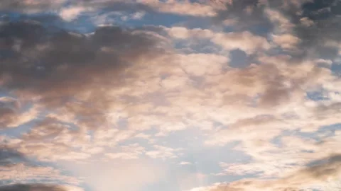 Epic time lapse of fast moving clouds and blue summer sky at beautiful sunset. Stock Footage 179509101