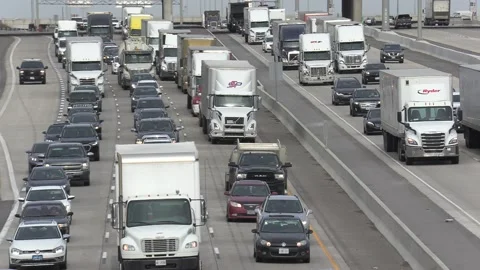 Epic Toronto highway traffic jam with cars and trucks on the busy 401 Stock Footage 151061087