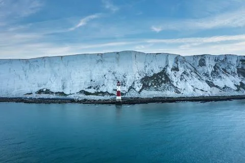 Epic vibrant Summer dawn landscape image of Beachy Head Lighthouse in South D Stock Photos