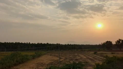 An epic view of a dark sunset over fields as seen from a speeding train.a m.. Stock Footage 313381325
