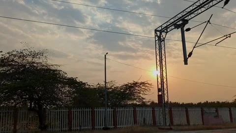 An epic view of a dark sunset over fields as seen from a speeding train.a m.. Stock Footage 313381332