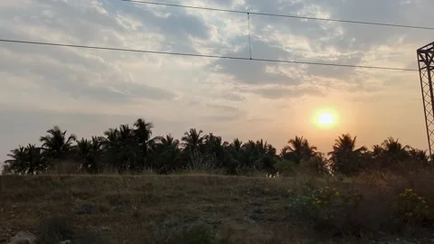 An epic view of a dark sunset over fields as seen from a speeding train.a m.. Stock Footage 313381338