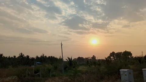 An epic view of a dark sunset over fields as seen from a speeding train.a m.. Stock Footage 313381343