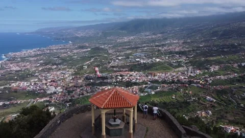 Epic View of La Orotava Valley and Ocean with Two Bikers, Tenerife 4K Stock Footage 171713992