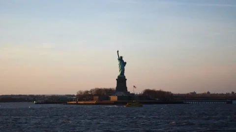 Epic view of the Statue of Liberty in the calm sea at sunrise minimalistic view Stock Footage 136214531