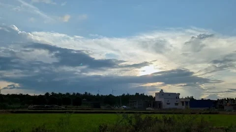 An epic view of a summer sunset over Indian village buildings amidst surrou.. Video stock 313381961