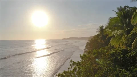 Epic view with sun flare of stunning tropical beach paradise at golden hour Video stock 154339510