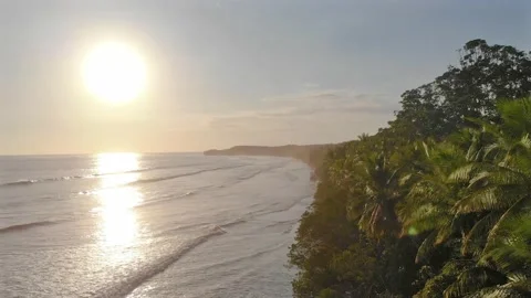 Epic view with sun flare of stunning tropical beach paradise at golden hour Stock Footage 154341709