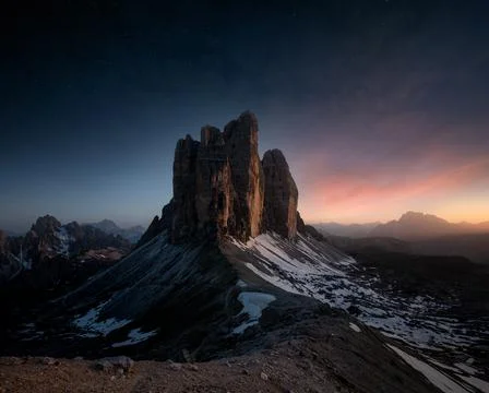 An epic view of Tre Cime Di Lavaredo mountain in sunset with stars on the sky Stock Photos