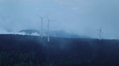 Epic view of wind turbines on the mountain in the low clouds and fog Stock Footage 278092901