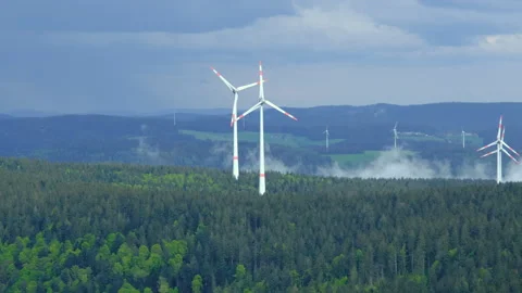 Epic view of wind turbines on the mountain in the low clouds and fog Stock Footage 278106292