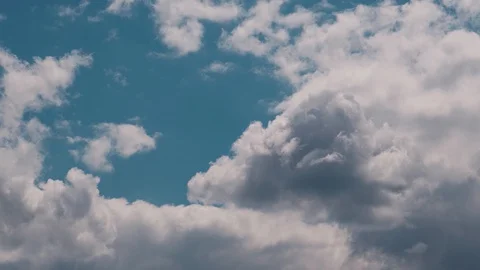 Epic volumetric clouds fly in the sky Stock Footage 128961070